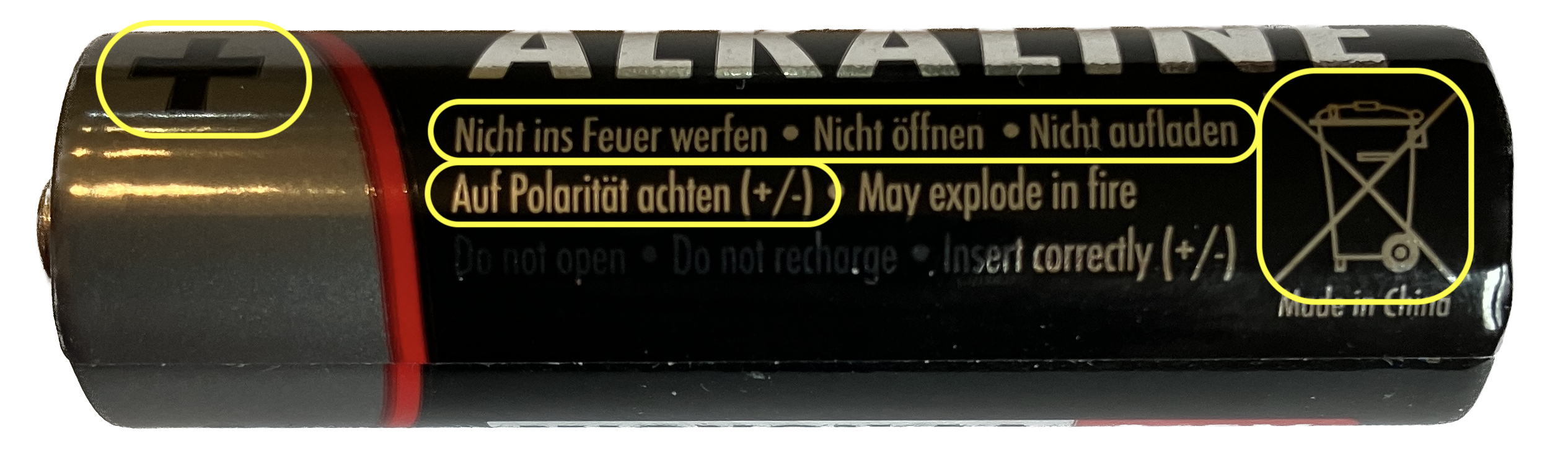 1) Kurzbeschreibung: Zylindrische Alkaline-Batterie mit gelben Markierungen für den Pluspol und mit Sicherheitshinweisen.
<ol start=